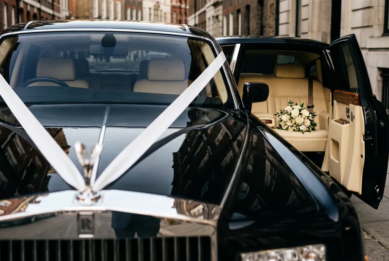 Wedding ribbon on the bonnet of a Rolls-Royce